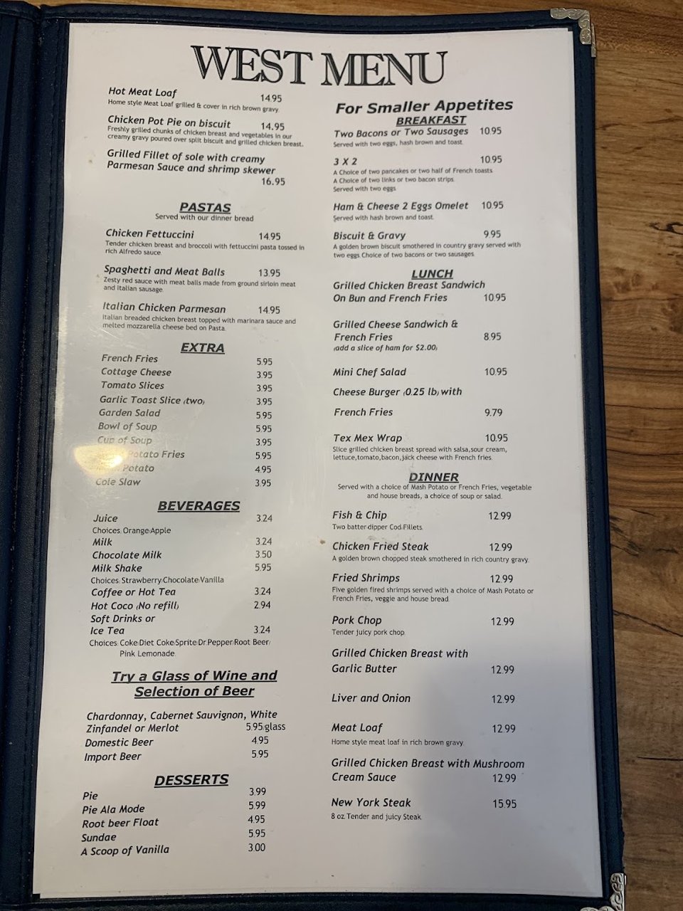Printed menu featuring curries, pancakes, and pasta.